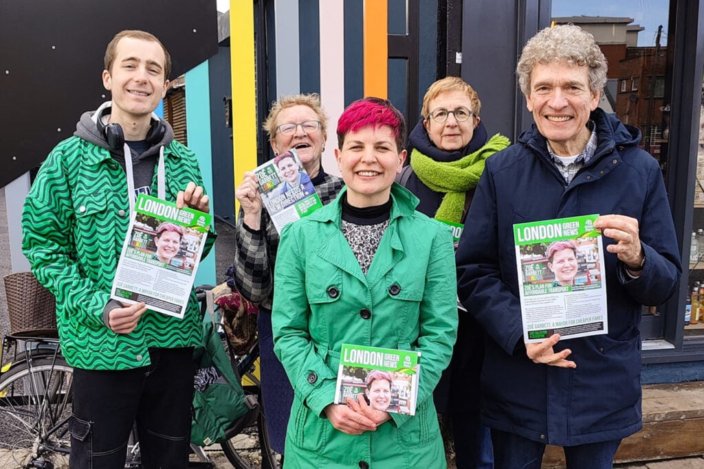 A group of Green Party volunteers posing with London mayoral candidate Zoë Garbett
